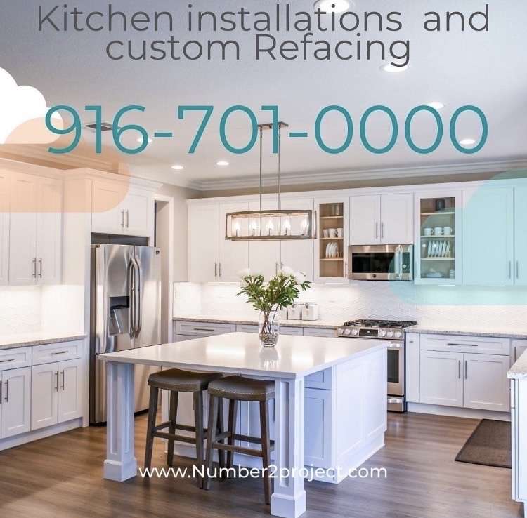 Modern kitchen with white cabinetry and a center island, installed by Number2Project, reflecting their specialized kitchen installation services
