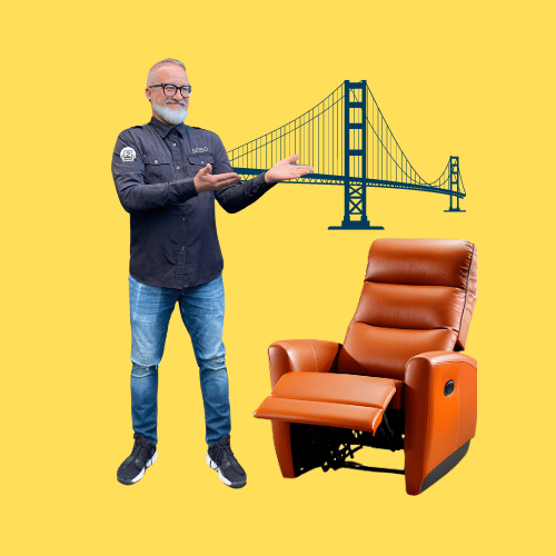 An affable man with glasses gestures towards a plush, brown leather recliner chair with the Golden Gate Bridge in the backdrop, against a bright yellow background.