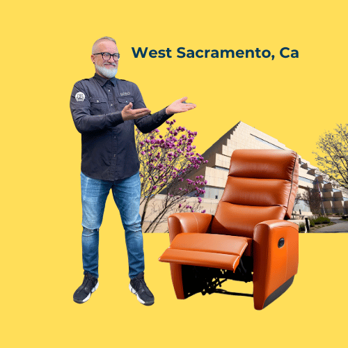 A cheerful repair expert gestures towards a luxurious leather recliner with West Sacramento neighborhood scenery in the background.