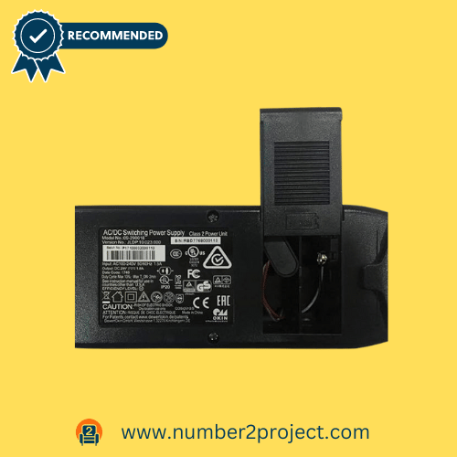 Close-up of the #311 Fromann power supply unit for recliner lift chairs, showing a detailed label and connector on a yellow background.