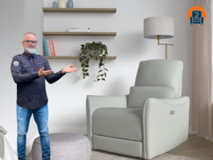 Sebastian from Number2project Mobile Furniture Repair presenting the CHITA Power Glider Swivel Rocker Recliner in a modern living room setting, showcasing its stylish design and comfortable features.