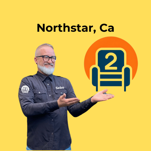 Sebo from Number2project Mobile Furniture Repair pointing to the company logo, promoting sofa and recliner repair services in Northstar, CA.