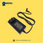 Black wall-plug recliner charger with flat cable and right-angle connector on a yellow background.