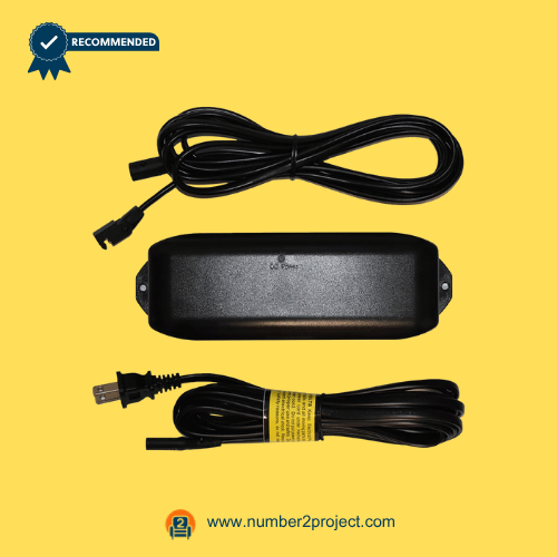 Three-piece recliner power supply kit with transformer box and two power cables on a yellow background.