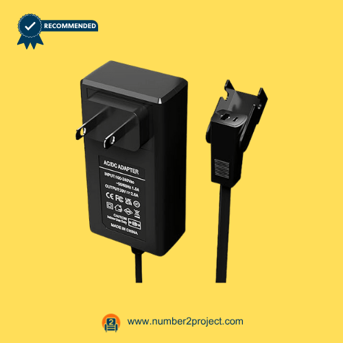 Black wall plug ACDC power adapter with a recliner connector on a yellow background.
