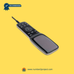 Angled view of a sleek multi-function recliner remote controller with control buttons and glossy front panel.