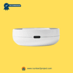 Close-up of a white device with a USB charging port on a yellow background.